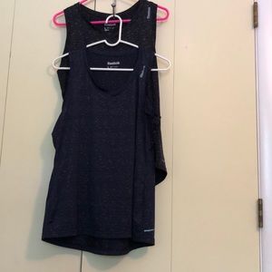 Two(2) Reebok SpeedWick v-neck tanks.
